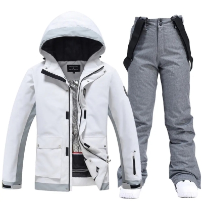 Couple White Athletic Ski Jackets And Ski Bibs Trousers
